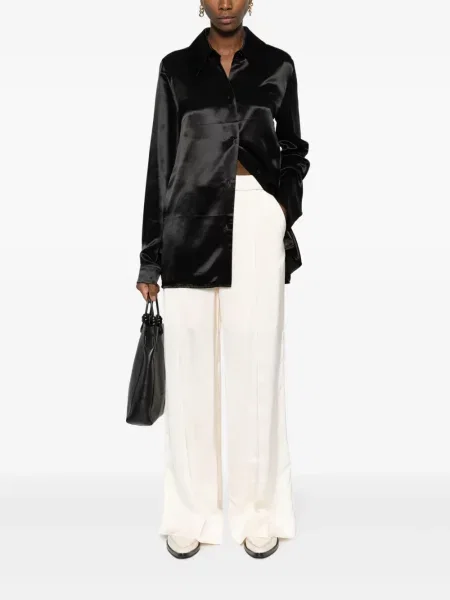 Platėjantys platėjančios kelnės Jil Sander
