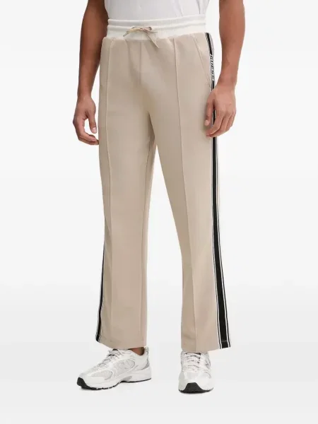 Pantaloni Guess cu dungi alergare