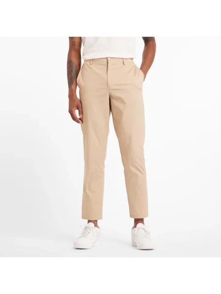 Spodnie New Balance – beżowe