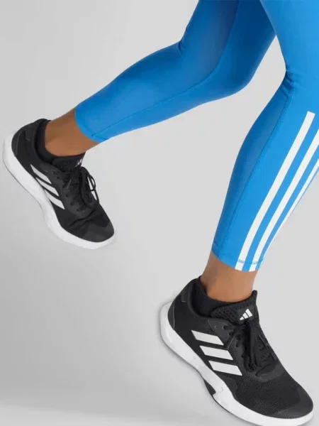 Legginsy o kroju slim fit z detalami z logo Adidas Sportswear niebieskie