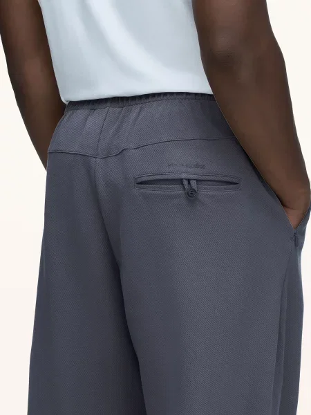 Adidas Kalhoty Adidas X Entire Studios Z.N.E. tmavě šedá