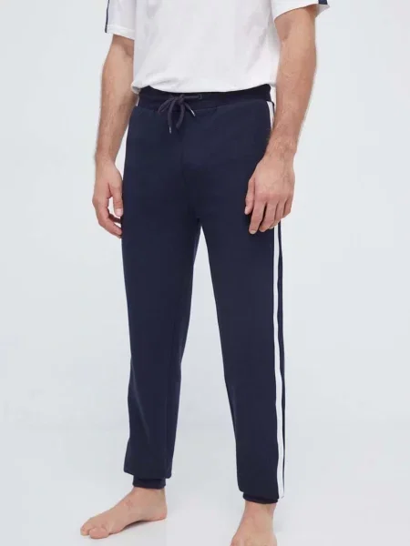 Donji dio trenirke Tommy Hilfiger tamno s aplikacijom plava