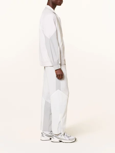 New Balance Spodnie Treningowe Archieve grau