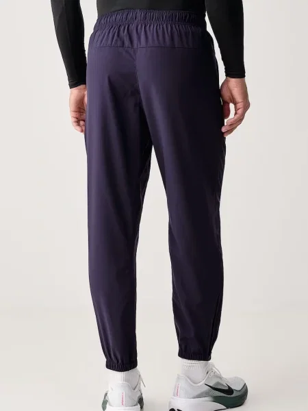 Nike spodnie treningowe Form Dri-FIT fioletowe