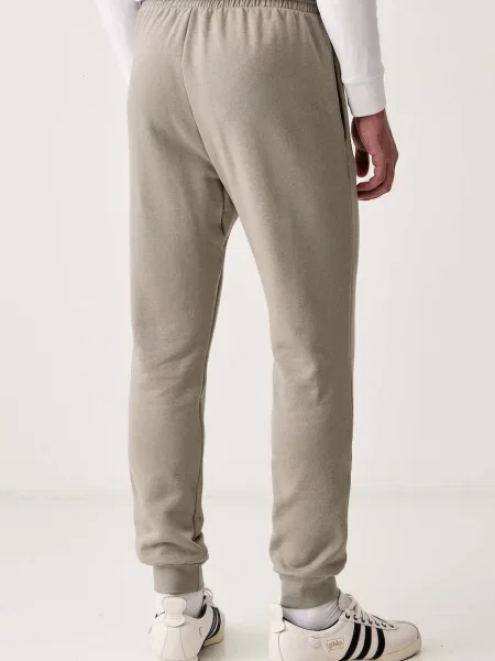 Adidas spodnie dresowe z bawełną Essentials Feelcozy zielone