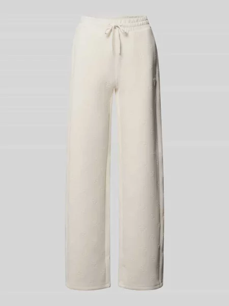Spodnie dresowe o kroju wide fit z nadrukiem logo allover model Calista' Guess Activewear białe