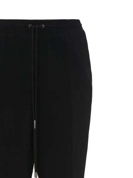 Kelnės Jw Anderson įsiliepsnojo juoda