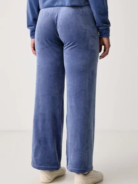 Juicy Couture Spodnie dresowe Old Gothic niebieski