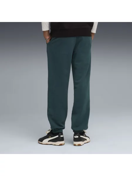 PUMA spodnie dresowe o luźnym kroju Wardrobe Essentials Odzież S zielony