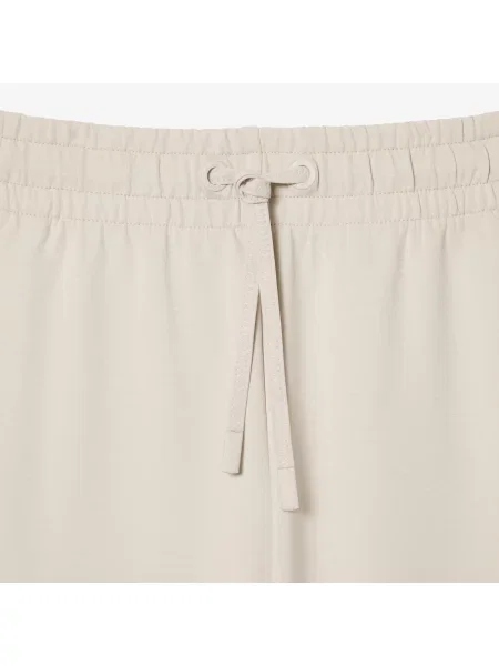 Зауженные спортивные штаны Lacoste красные