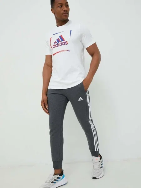Csíkos frottír melegítőnadrág Adidas szürke