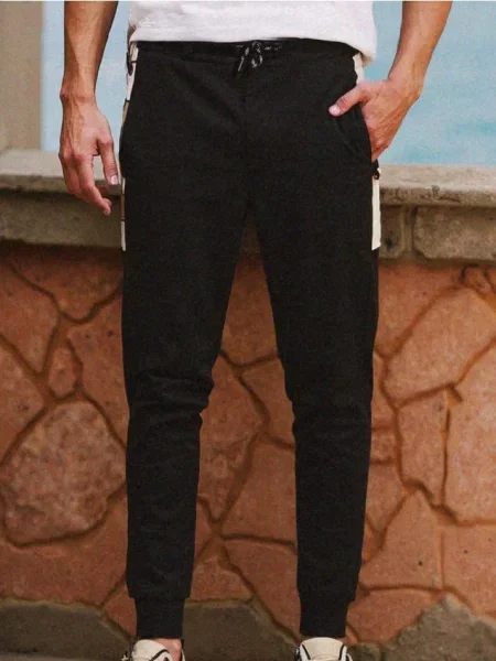 Sinsay Teplákové kalhoty se širokými nohavicemi černá