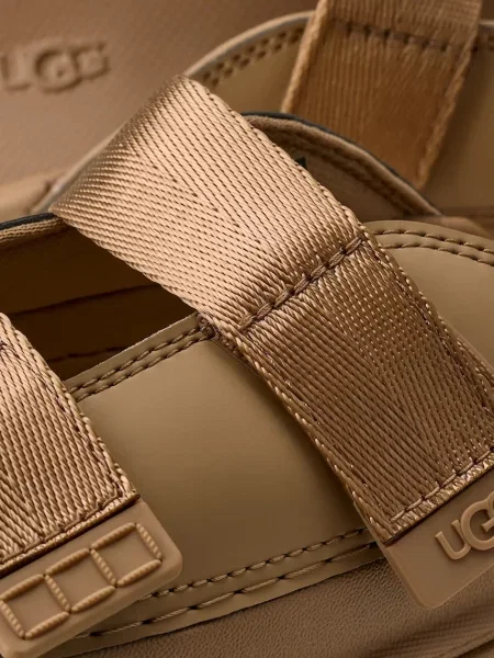 UGG шльопанці дитячі GOLDENGLOW SLIDE