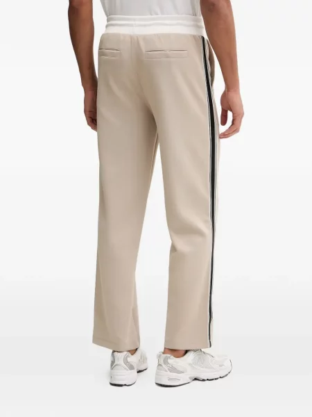 Pantaloni Guess cu dungi alergare