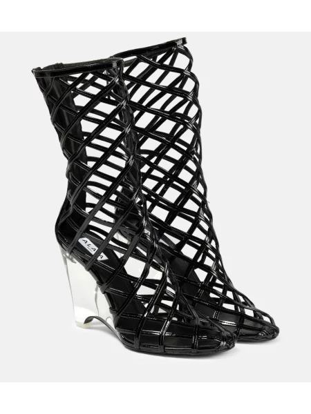Cizme scurte Alaïa din piele cu pană negru