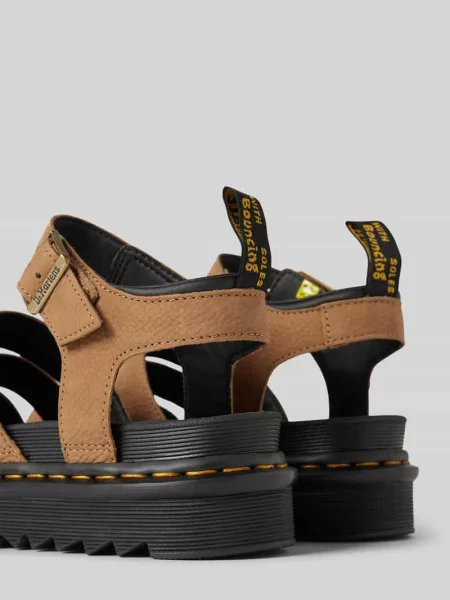 Sandały skórzane z podeszwą na platformie Dr. Martens beżowe
