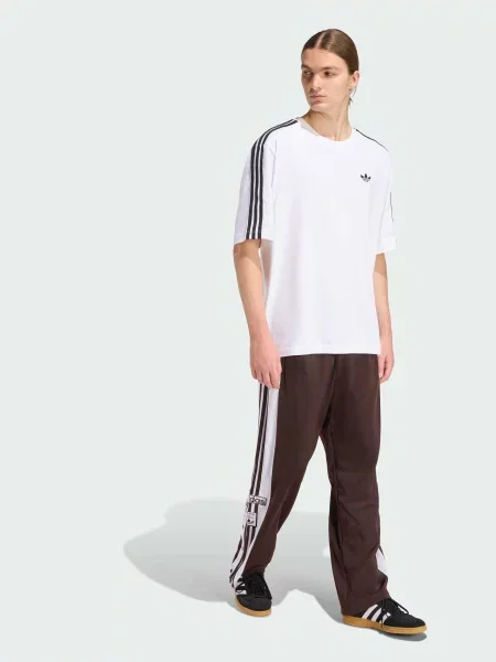 Повседневные переработанный брюки Adidas коричневые