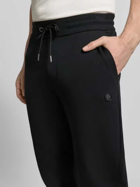 Spodnie dresowe o kroju regular fit z Mieszanka bawełny Model ‚LOCSIN’ Boss czarne