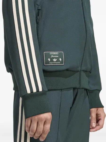 Pruhované kalhoty Adidas s výšivkou na platformě černé