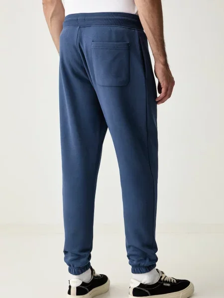 Tommy Jeans spodnie dresowe z bawełną granatowe