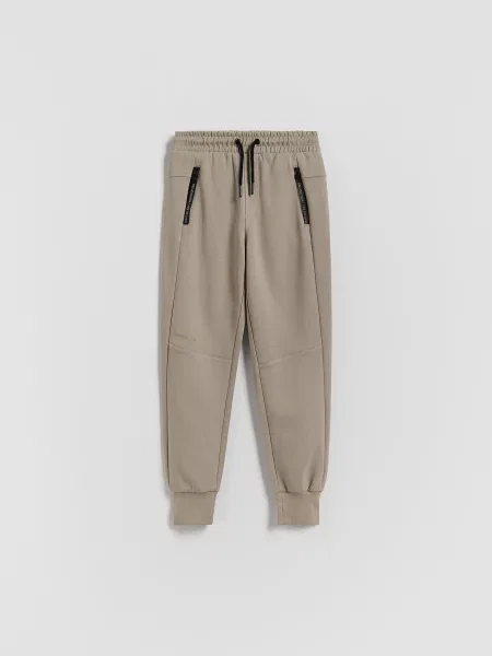Reserved Спортивні штани jogger бежевий