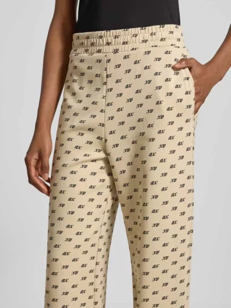 Spodnie dresowe z mieszanki bawełny o kroju wide leg Armani Exchange beżowe