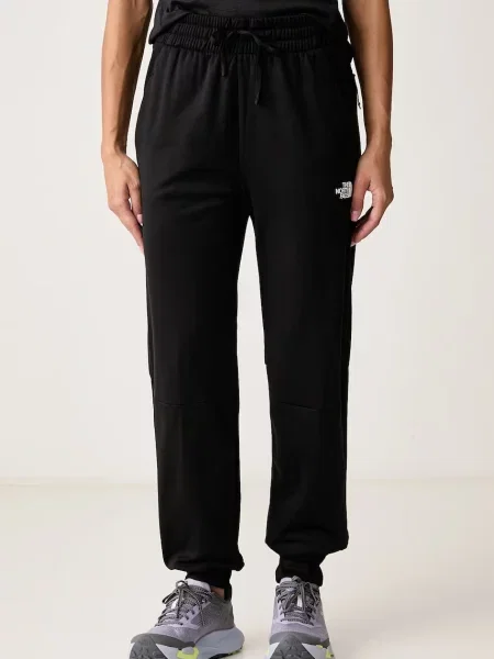 The North Face pantaloni de trening pentru femei MOUNTAIN ATHLETICS negru