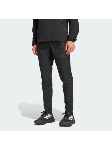 Kalhoty Tiro Travel Woven Pants černé