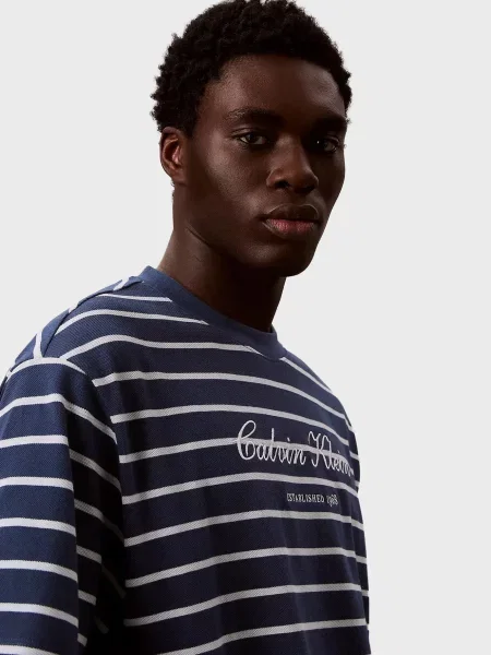 У смужку повсякденна футболка Calvin Klein Jeans синя