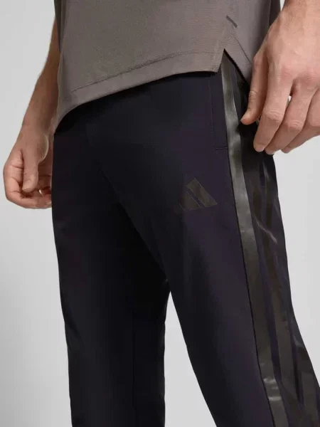 Spodnie dresowe z elastycznym pasem Adidas Sportswear czarne