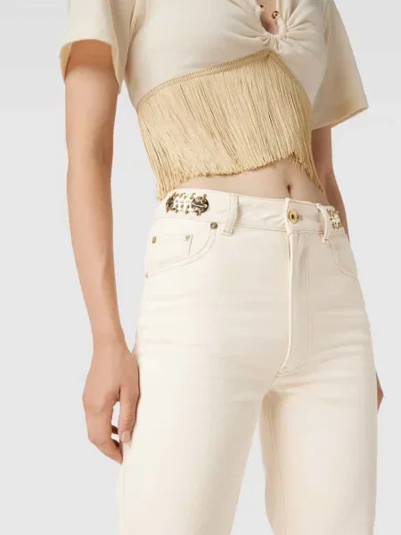 Jeans o rozkloszowanym kroju z ozdobnymi aplikacjami Rabanne beżowe