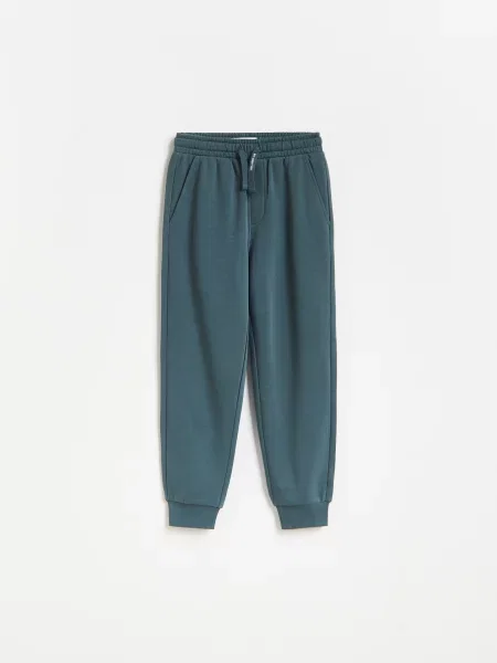 Reserved Pantaloni de jogging din metalizat albastru