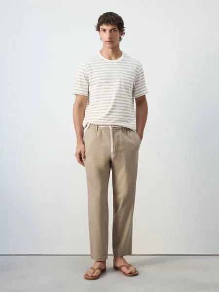 Spodnie relaxed fit z mieszanki bawełny i lnu Mężczyzna 44 MANGO MAN beżowy