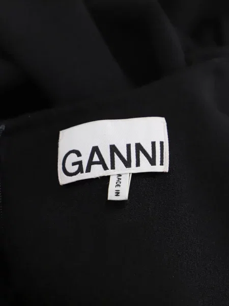Odgovarati mini haljina Ganni s volanima crna