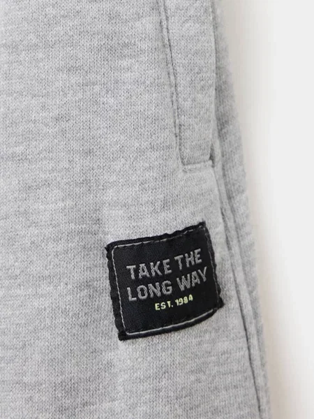 Spodnie jogger relaxed fit średni Dzieci 9 MANGO KIDS szary