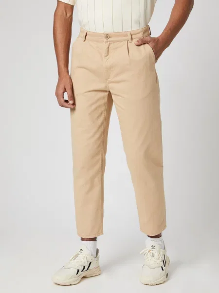 Kosta Williams x About You Pantaloni cutați bej