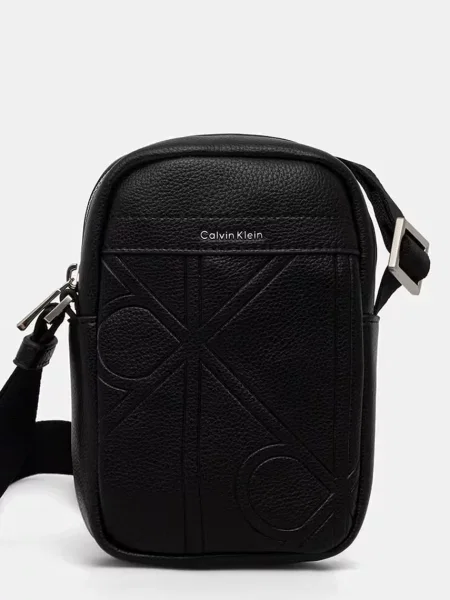Calvin Klein Geantă crossover Emblem Aop Emboss Slim Reporter negru