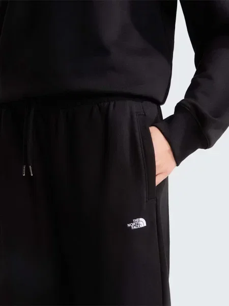 Повсякденні штани The North Face W TNF ESSENTIAL TERRY SIMPLE D бавовна/поліестер чорний
