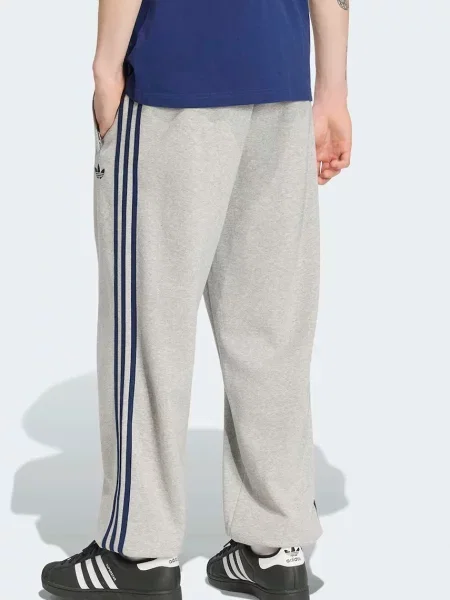 Adidas Originals teplákové nohavice pánske s bavlnou Adicolor sivá