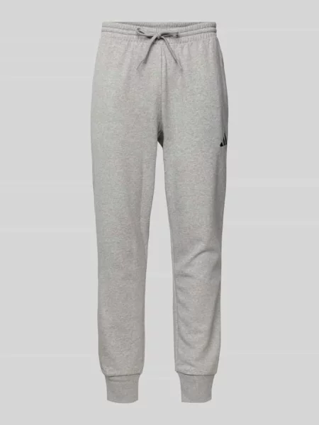 Spodnie dresowe o kroju relaxed fit z wyhaftowanym logo Adidas Sportswear szare
