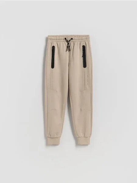 Reserved Pantaloni din jogger bej