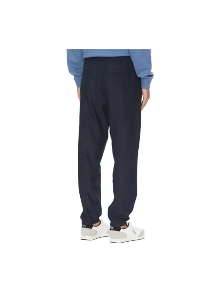 Spodnie dresowe Calvin Klein Jeans frotte niebieskie