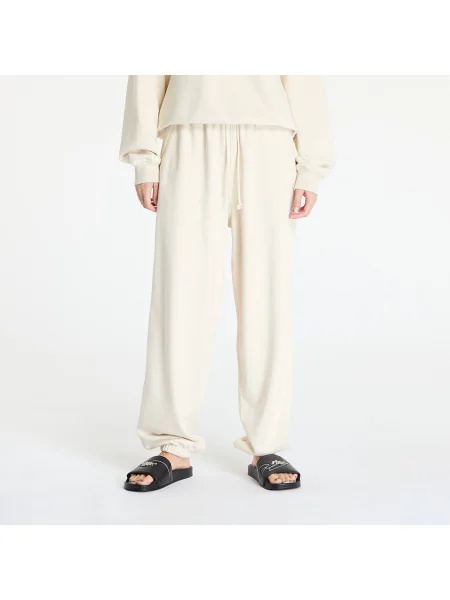 Spodnie New Balance – beżowe