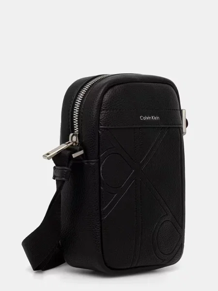 Calvin Klein Geantă crossover Emblem Aop Emboss Slim Reporter negru
