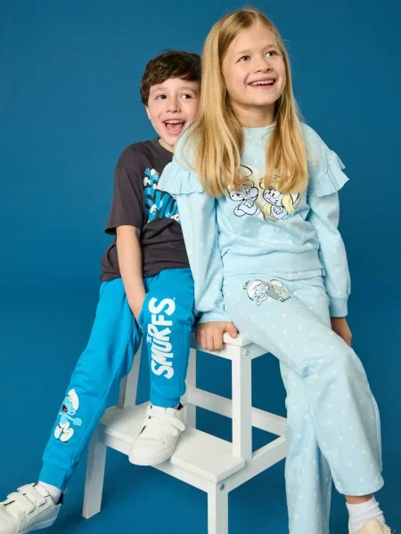 Sinsay Kalhoty The Smurfs světle modrá