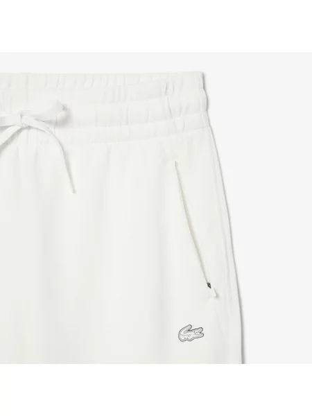Зауженные спортивные штаны Lacoste белые