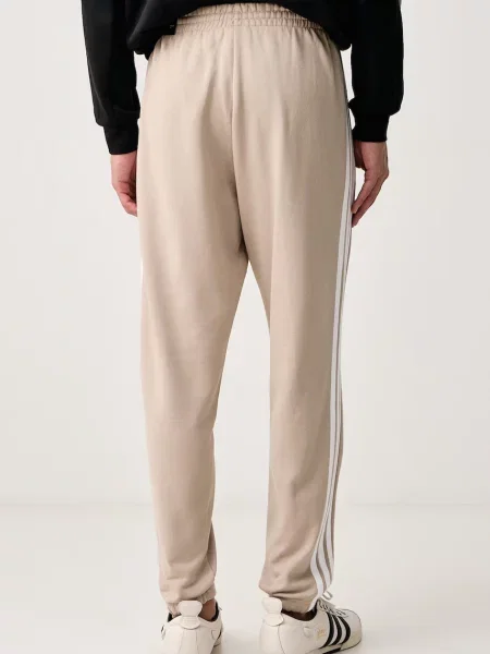 Adidas spodnie dresowe Essentials beżowe