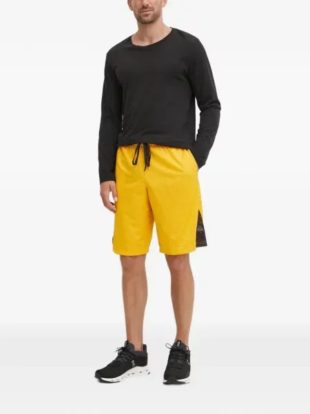 Pantaloni scurți Reebok plasă galben