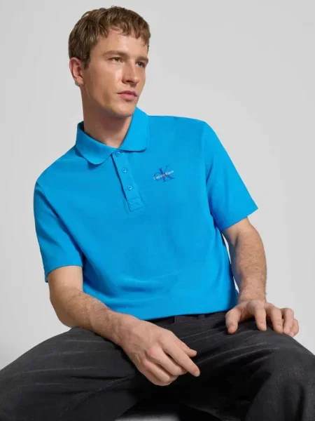 Koszulka polo o kroju easy fit z kołnierzykiem polo Calvin Klein Jeans niebieskie