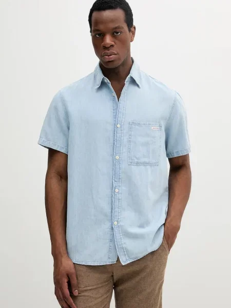 Koszula jeansowa z kołnierzykiem typu kent Calvin Klein Jeans niebieska
